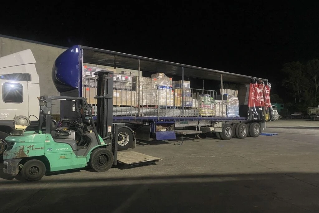 freight forwarding truck for warehousing & distribution being unpacked with forklift